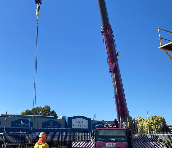 C0 Slewing Mobile Crane (Over 100 Tonnes) in operation under a clear sky at Saferight's training facility.