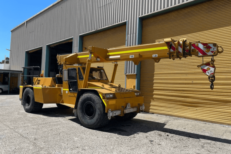 Operate a Non-Slewing Mobile Crane (Greater Than 3 Tonnes) CN Crane parked outside of warehouse at Saferight facility.