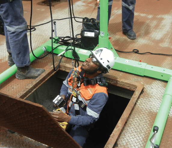 Saferights Confined Space entry course student being lowered into at man hole at Saferights Perth training facility.