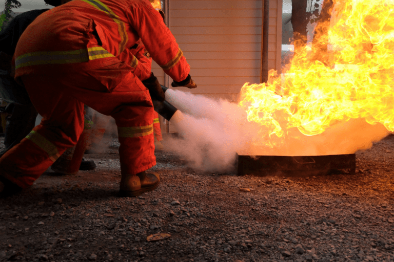 Basic Fire Training Perth Demonstrate First Attack Firefighting Equipment - Small fire safety course situation of a life like fire being extinguished by Saferight trainees.