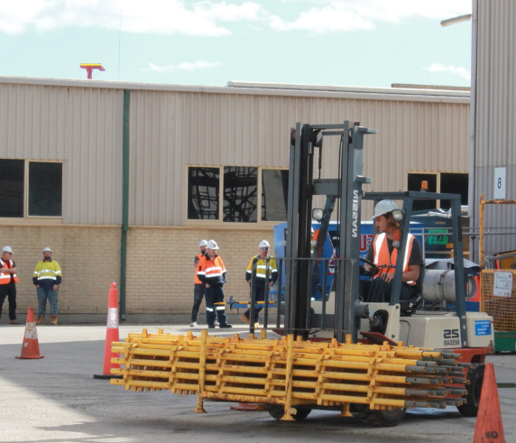 Saferight Fork Lift operator course trainee moving a load of scaffold at the Saferight Training facility in Perth.