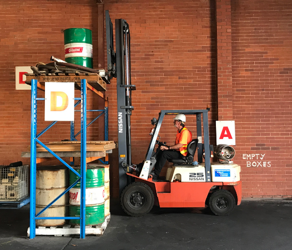 Saferight Forklift Licence Perth trainee moving a pallet from a high storage shelf in comprehensive Forklift Training in Perth to obtain Forklift Ticket in Perth.