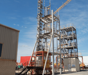 Operate Personnel and Materials Hoist training at Saferight's facility with a clear blue sky background.