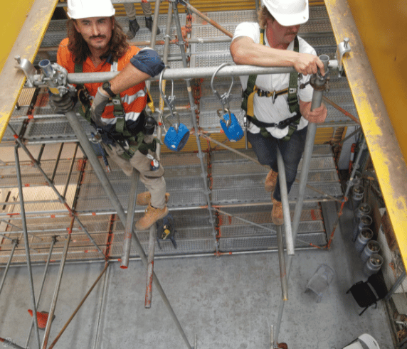 Two scaffolders working on scaffold at Saferights scaffolding advanced course.