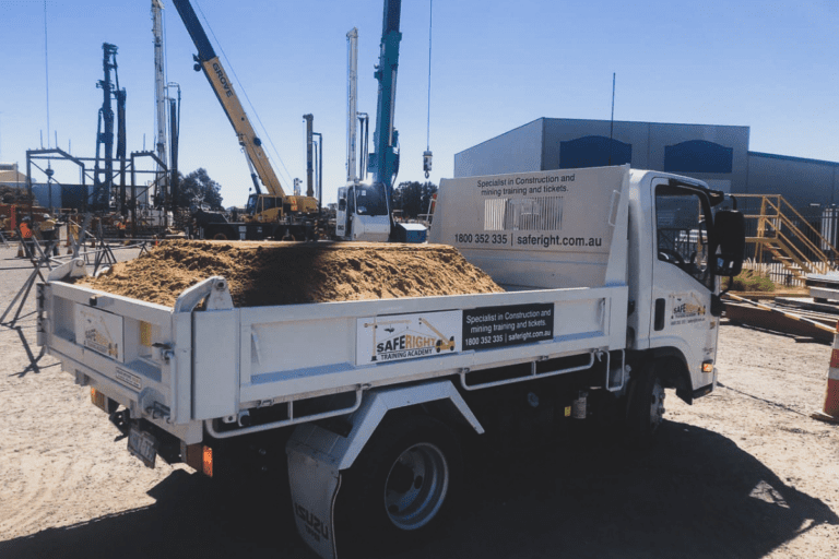 conduct tip truck operations. Saferight-branded tip truck loaded with soil at a construction training site