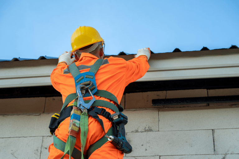 Saferight's trainee standing at a high level working on a roof during their Work Safely At Heights course delivered by Saferights.