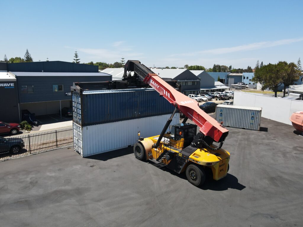 Operator completing TLILIC0011 reach stacker training at Saferight Perth facility.