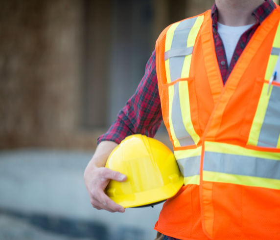 Construction worker in high-vis vest holding hard hat – symbolising Health and Safety Representative training in Perth